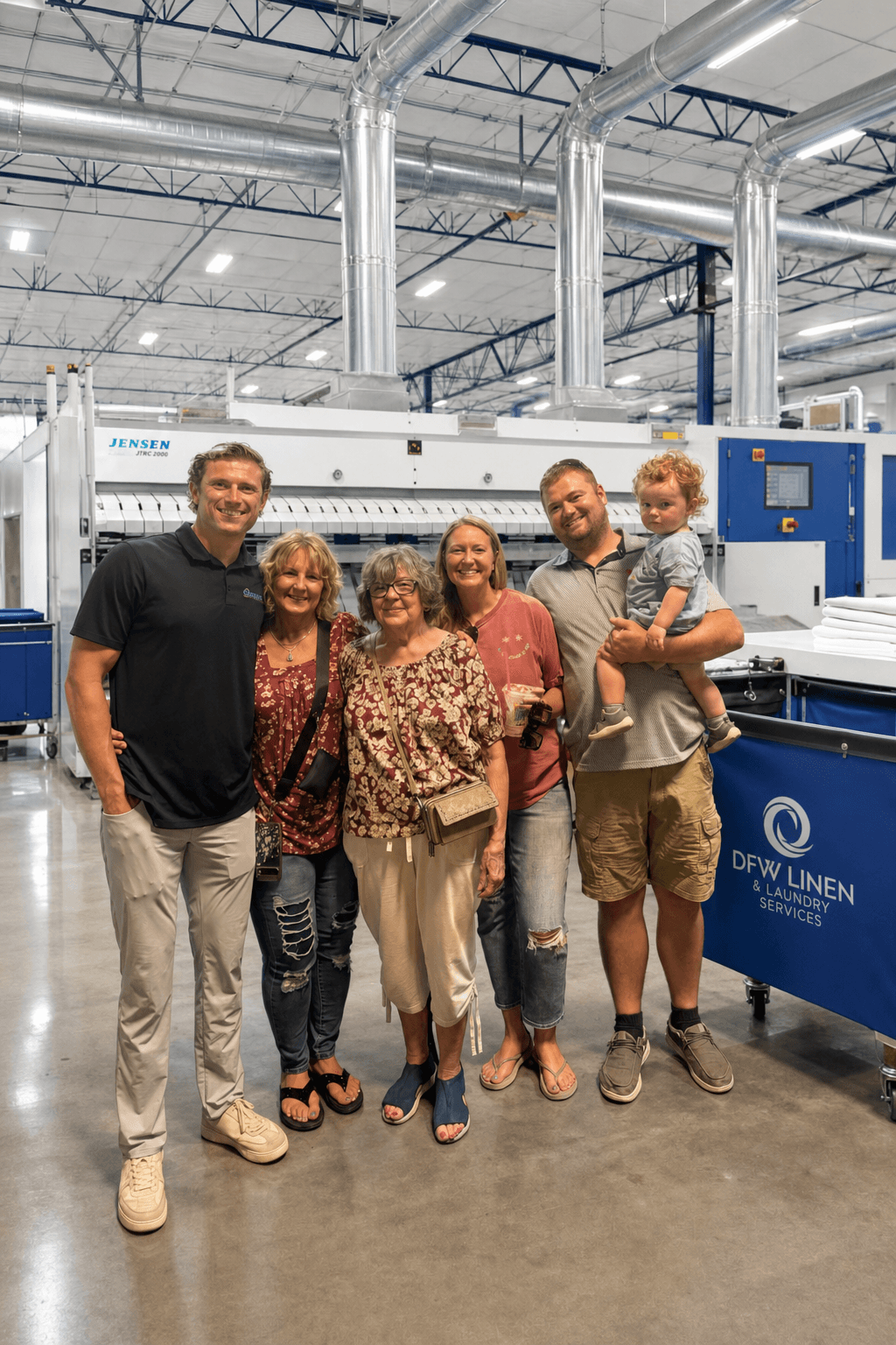 DFW Linen and Laundry family at our Addison commercial laundry plant with modern finishing equipment